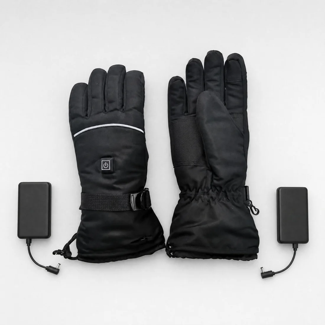 A pair of heated gloves with their two power packs