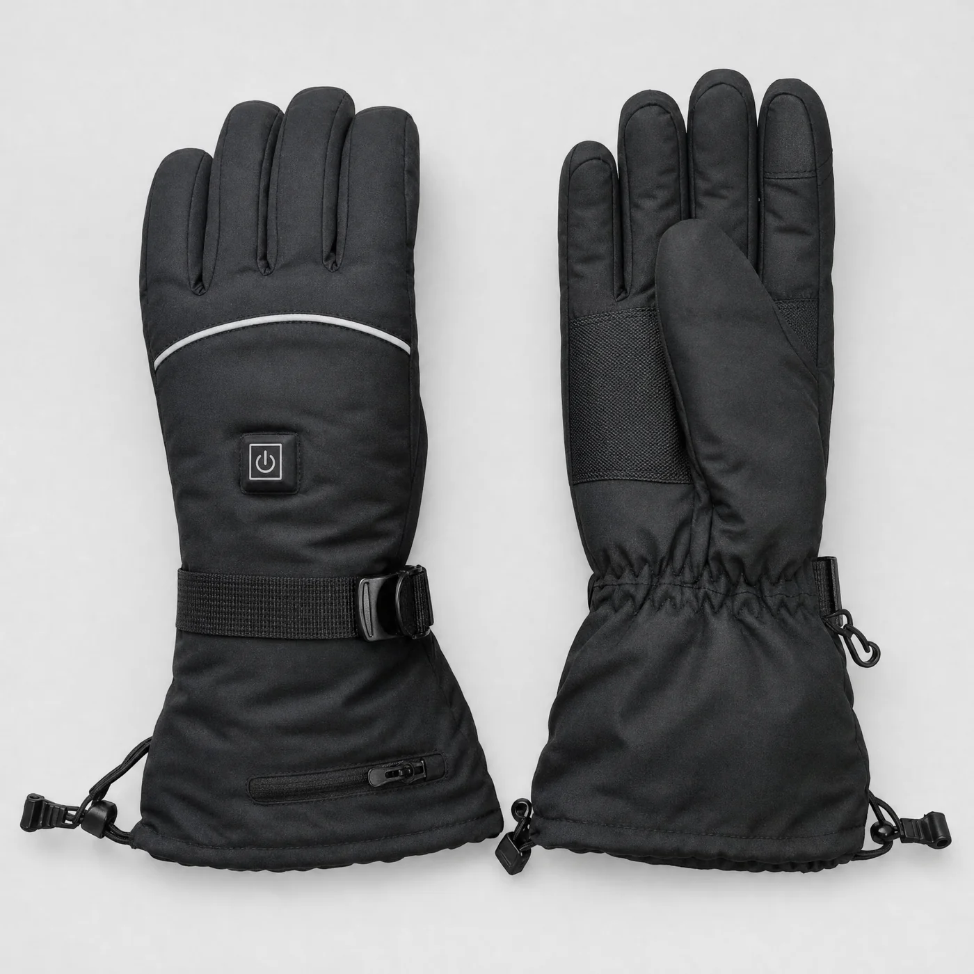 Pair of black heated gloves with a power button on the back of the hand, on a light grey background